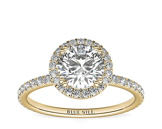 Beautifully crafted, this Blue Nile Studio 18k yellow gold engagement ring features a French pavé-set diamond halo that encompasses the center diamond of your choice.