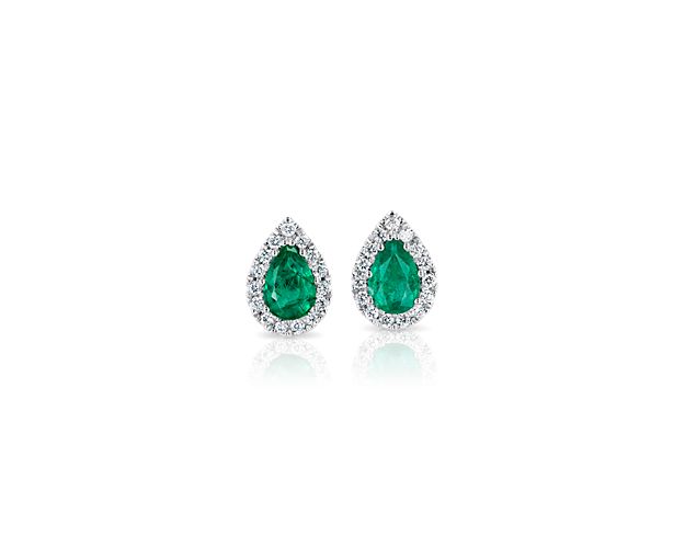 Dress up with brilliant sparkle and chic color with a pair of these glamorous stud earrings. Two pear-cut emeralds are surrounded by a halo of dazzling diamond pavé for a look so perfectly beautiful it's instantly classic.