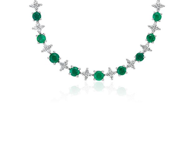 Floral shapes of round-cut diamonds shine from in between emerald gemstones, all set in stunning 18k white gold. Secure this sophisticated eternity necklace with a box clasp closure.