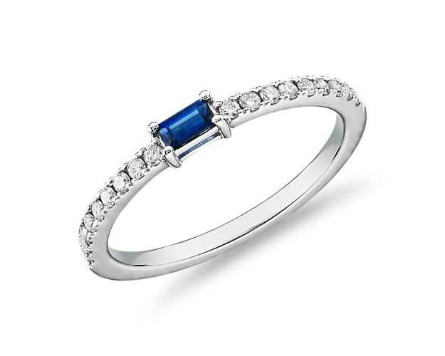 Emanating vibrant color and significant sparkle, this 14k white gold ring showcases a baguette-cut sapphire center stone with rows of pavé-set diamonds running down each side of the band. Due to this ring's delicate nature, we do not recommend for daily wear and are unable to resize or repair.