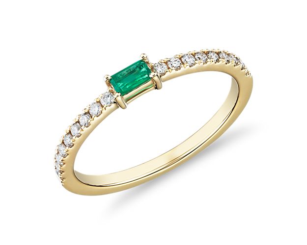 Harmoniously pieced together, this ring features a verdantly-hued baguette-cut emerald center stone on a 14k yellow gold band sparkling with pavé-set diamonds for a timeless design. Due to this ring's delicate nature, we do not recommend for daily wear and are unable to resize or repair.