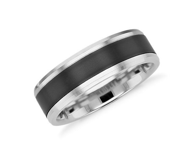 This white gold wedding ring is inset with a band of lightweight titanium. The satin finish on the white gold is smooth, which balances nicely against the matte black titanium.
