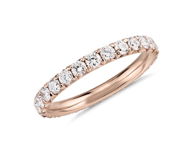 This 1 ct. tw. pavé diamond eternity ring showcases a full circle of round brilliant-cut diamonds set in polished 14k rose gold. The endless sparkle of this refined style is perfect as a wedding or anniversary ring.