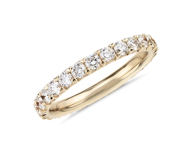 This 1 ct. tw. French pavé diamond eternity ring showcases a full circle of round brilliant-cut diamonds set in polished 14k yellow gold. The endless sparkle of this refined style is perfect as a wedding or anniversary ring.