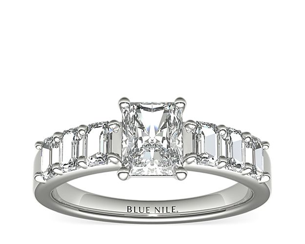 Both striking and sophisticated, emerald cut diamonds are the perfect accent for this timeless engagement ring. Crafted in enduring platinum, this ring features six perfectly-matched emerald-cut diamonds prong-set alongside your choice of center diamond for a uniquely eye-catching look.
