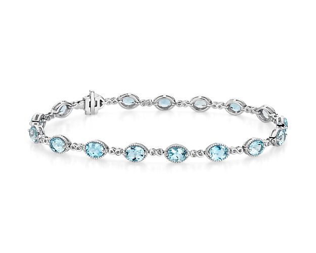Crafted from 14k white gold, this gorgeous bracelet’s 17 oval-cut aquamarine gemstones shimmer when the light hits them. Each gemstone is separated by small infinity links symbolizing eternity.