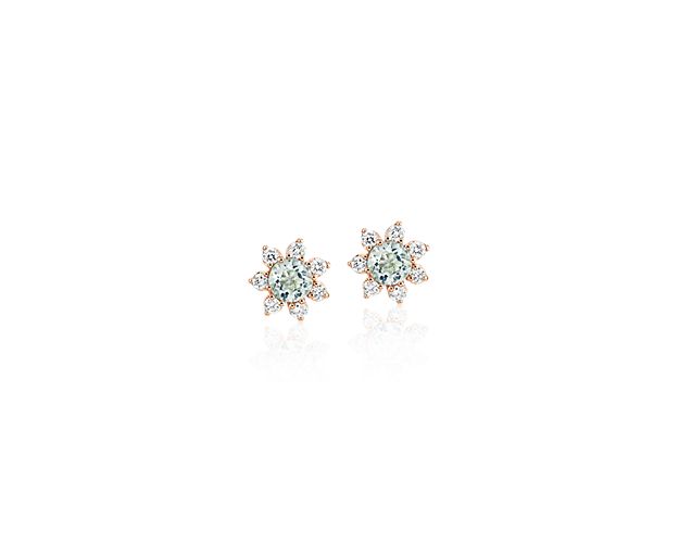 Each of these eye-catching 14k rose gold stud earrings feature a single aquamarine stone surrounded by a blossom halo of brilliant diamonds for a look that’s both colorful and chic.