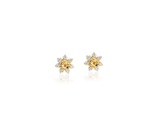 Each of these eye-catching 14k yellow gold stud earrings feature a single citrine stone surrounded by a blossom halo of brilliant diamonds for a look that’s both colorful and chic.