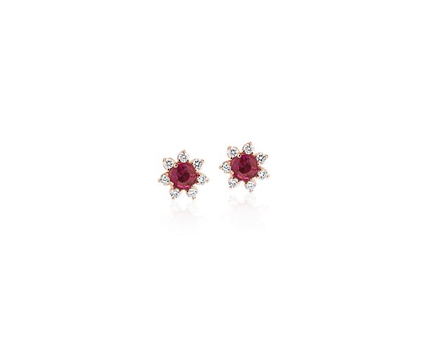 Each of these eye-catching 14k rose gold stud earrings feature a single ruby surrounded by a blossom halo of brilliant diamonds for a look that’s both colorful and chic.