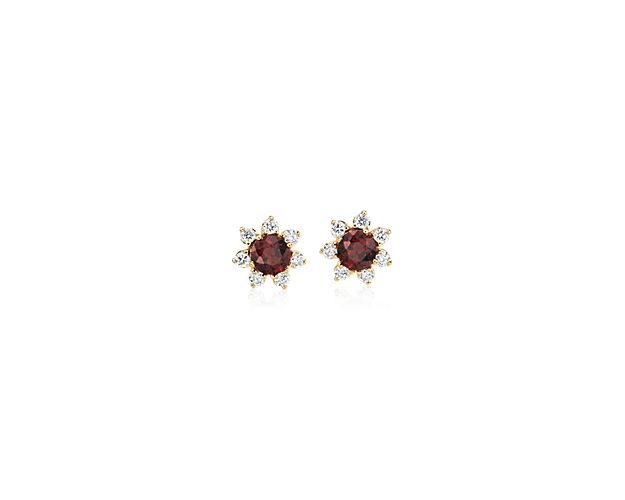 Each of these eye-catching 14k yellow gold stud earrings feature a single garnet stone surrounded by a blossom halo of brilliant diamonds for a look that’s both colorful and chic.