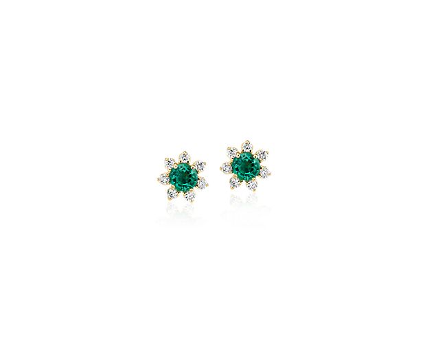 Each of these eye-catching 14k yellow gold stud earrings feature a single emerald stone surrounded by a blossom halo of brilliant diamonds for a look that’s both colorful and chic.