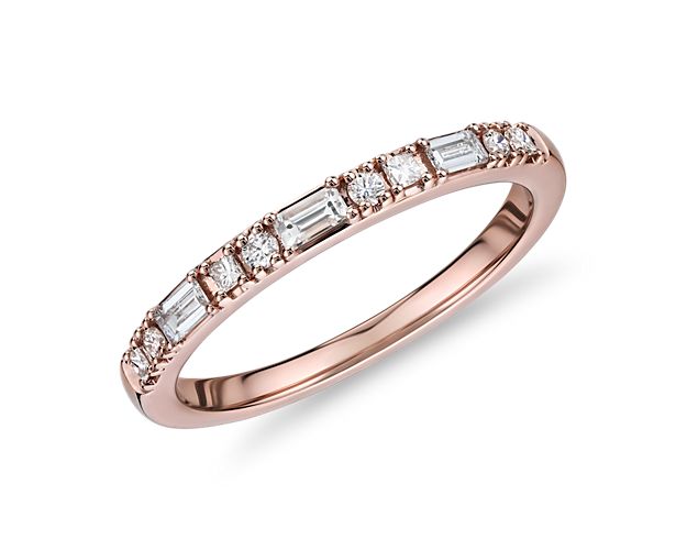A variety diamond cuts - princess, round and baguette - combined with the 14k rose gold, give this dot dash anniversary ring an unmistakably modern effect. A perfect match with stock number 73608.