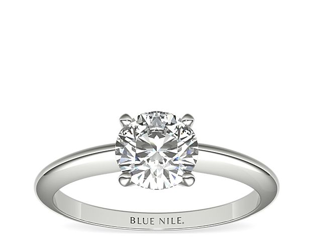 Let your diamond shine brilliantly in this classic platinum four-prong solitaire engagement ring. The slim silhouette and polished finish exemplify timeless style. Select from a variety of diamond shapes to create the perfect classic solitaire engagement ring for you.