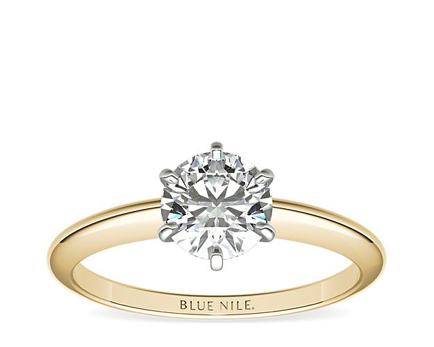 This 18k yellow gold, six-prong solitaire is the ultimate classic engagement ring style. Crafted to showcase your choice of diamond, six slim platinum prongs secure and support the center stone. The slender silhouette and polished finish of this solitaire exemplify timeless design, proving simple can be truly stunning.