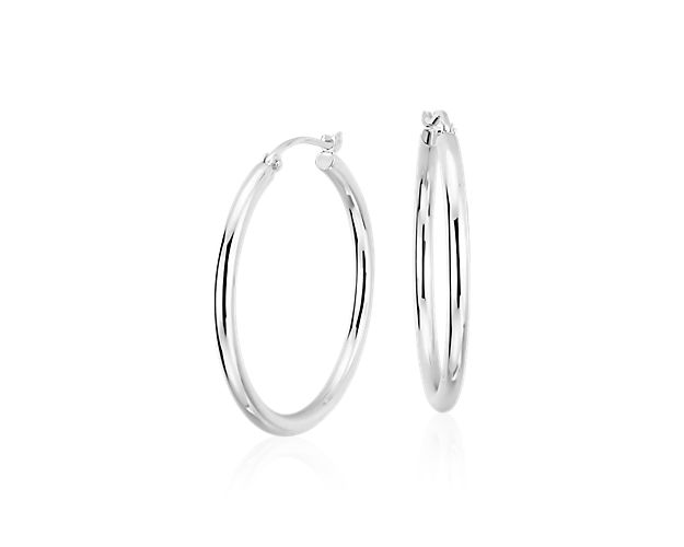A style essential, these medium hoop earrings are crafted from hypoallergenic platinum tubing for a polished, lightweight look, finished with a latch back closure.