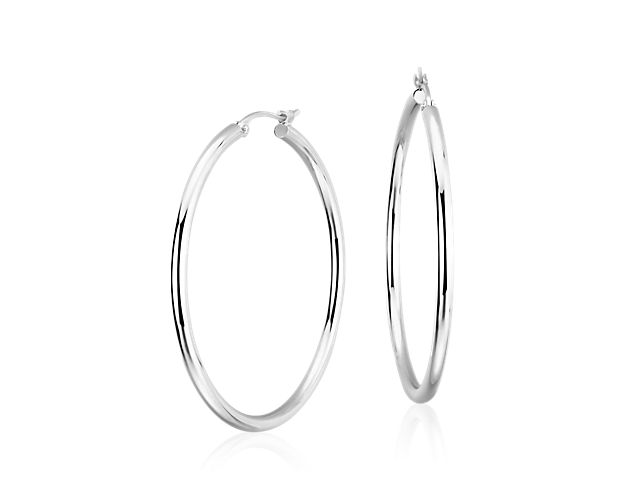 An essential, laid back style, these large platinum hoop earrings are the perfect pair. The hypoallergenic nature of platinum, lightweight hollow tubing construction, and petite size of these hoop earrings make them comfortable for regular wear, with a latch back post that's secure and easy to operate.