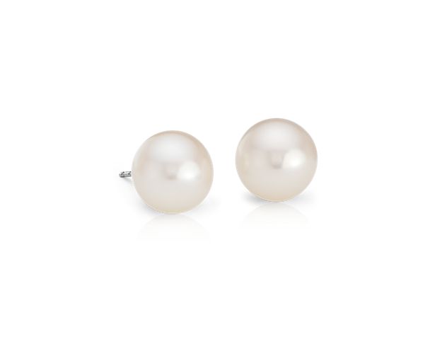 Two luminous white Freshwater cultured pearls mounted on bright 14k white gold posts with push backs for pierced ears provide a classic look with incredible versatility- an essential style!