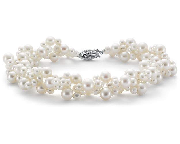 A wedding day favorite, our woven Freshwater cultured pearl bracelet is a beautiful piece of special occasion jewelry. Clusters of varied-size white pearls are finished with a 14k white gold filigree clasp for an elegant look.