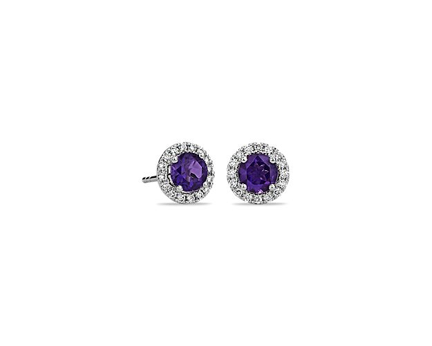 These deep purple amethyst and diamond halo earrings are an excellent choice for someone who wants to add a bit of color to a classic style. Crafted in bright 18k white gold, these gemstone stud earrings feature round amethysts surrounded by sparkling halos of micropavé diamonds. Their petite size makes them a great everyday jewelry option.
