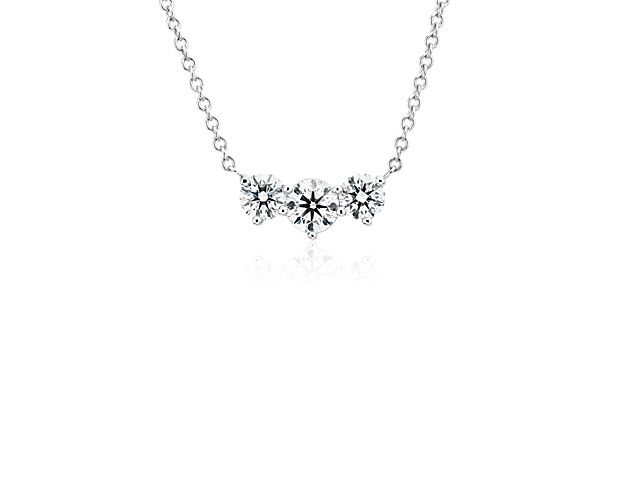 Strength in elegance, this diamond necklace has three brilliant diamonds for total 1 1/2 carats and is set in platinum for maximum sparkle, a stunning piece for day or evening.