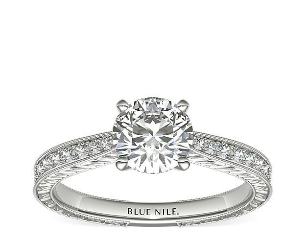 Inspired by vintage design, this diamond engagement ring in platinum features a hand-engraved motif throughout, framed by delicate milgrain edges. Each shoulder is set with micro-pavé round brilliant-cut diamonds to perfectly accent a center diamond of your choice.