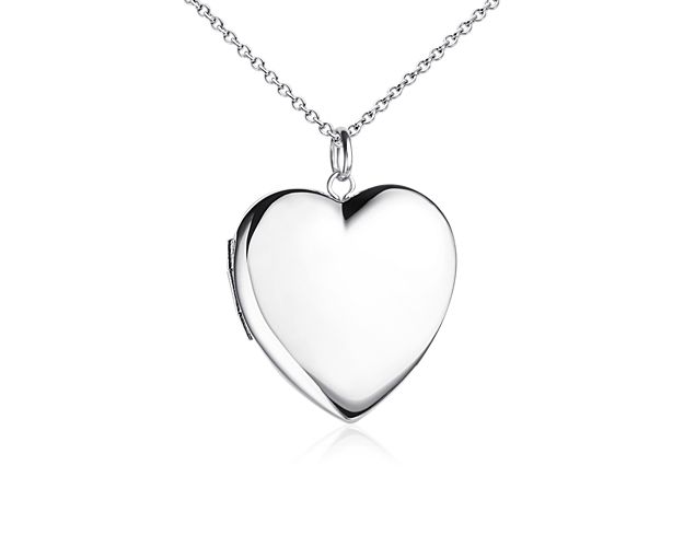 Heartfelt and delicate, this heart locket opens with a snap clasp to present two of your favorite photos and is suspended from a cable chain.
