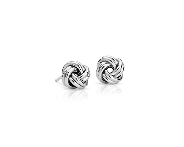 You'll adore these love knot earrings they go with any outfit. Crafted in polished sterling silver, their symbolic design and petite size is eye-catching without ever being over-the-top.