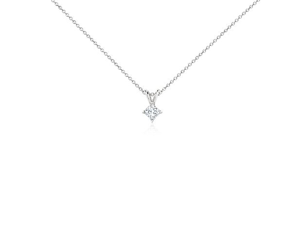 A near-colorless diamond is secured at the corners by platinum prongs. A platinum bail suspends the pendant from a platinum cable-link chain. 1/3 carat total diamond weight.