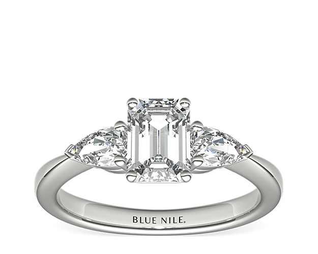 Exceptionally crafted, this diamond engagement ring showcases two beautifully matched pear-shaped diamonds prong-set in platinum to frame your center diamond. Diamonds equal 1/2 carat total weight.