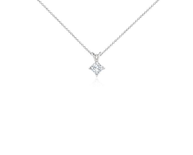 A princess-cut diamond is held by platinum prongs. A platinum bail suspends the pendant from a cable-link chain. 1 carat total diamond weight. Accompanied by either a GIA or GCAL diamond grading report.