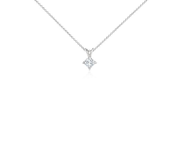 A princess cut diamond is held by platinum prongs. A platinum bail suspends the pendant from a cable-link chain. 3/4 carat total diamond weight. Accompanied by either a GIA or GCAL diamond grading report.
