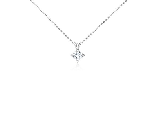 A near-colorless diamond is secured at the corners by 18k white gold prongs. An 18k white gold bail suspends the pendant from an 18k white gold cable-link chain. 1.5 carat total diamond weight. Accompanied by either a GIA or GCAL diamond grading report.