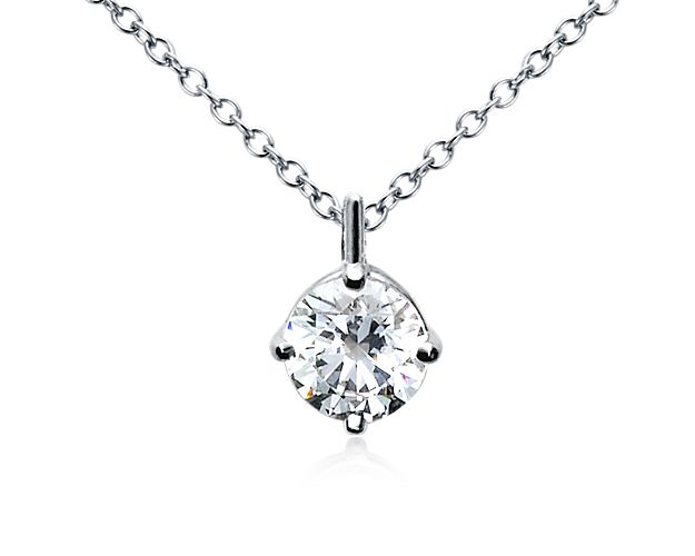 This elegantly simple pendant setting showcases your choice of round center diamond on an 18k white gold adjustable cable chain 16-18inches in length.