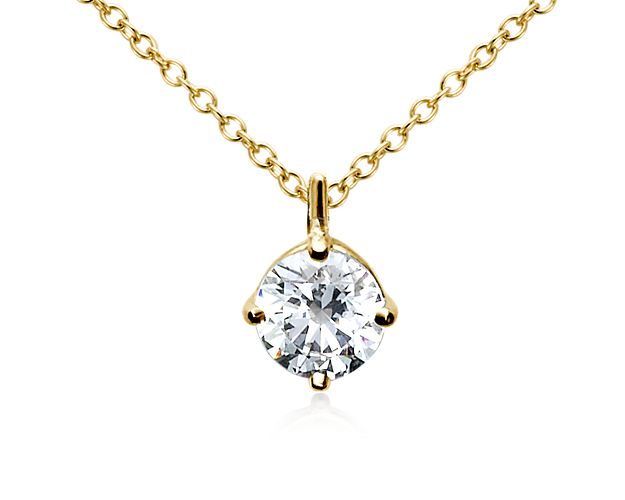 This elegantly simple pendant setting showcases your choice of round center diamond on an 18k gold adjustable cable chain 16-18inches in length.