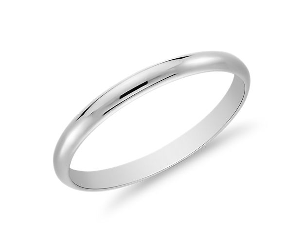 This classic 14k white gold wedding ring will be your lifetime essential. A low profile and light overall weight make it comfortable for everyday wear and a perfect complement to any white gold engagement ring. The high polished finish glimmer of the ring serves as a personal reminder of the promise you make on your big day.