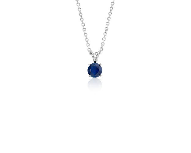 A forever classic, this sapphire solitaire pendant is a perfect gift for an occasion and also makes the perfect September birthstone gift. A petite, deep blue sapphire is framed in 18k white gold and suspended from a timeless, matching cable chain.