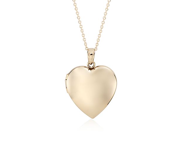 She'll appreciate the personal touch of this sweetheart locket. Crafted in lightweight, hollow 14k yellow gold with a matching cable chain, this classic locket holds two photos, making it easy to hold precious memories close.