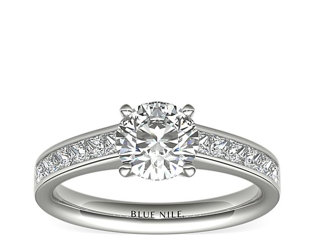 Elegant and unique, this diamond engagement ring showcases twelve princess-cut diamonds that are channel-set in 14k white gold to accent your center diamond. Setting includes ½ carat total diamond weight.