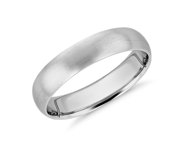 This mid-weight, matte, platinum wedding ring has a traditional higher domed exterior profile and a curved inner edge, which makes it extra comfortable for everyday wear.