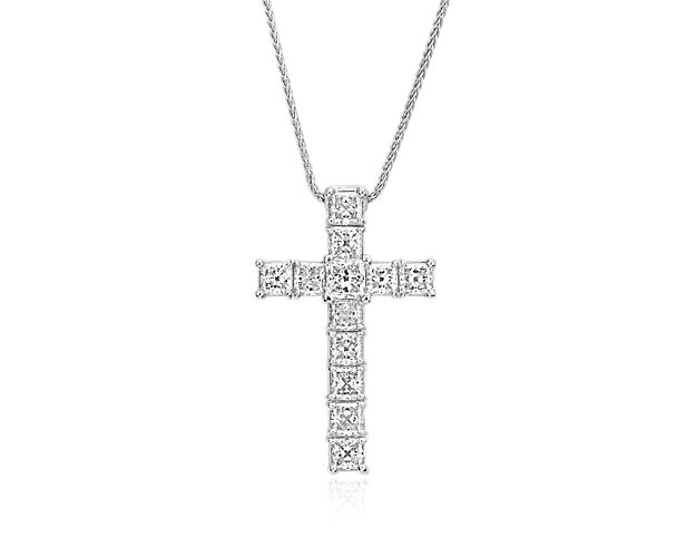 Beautifully crafted, this impressive diamond cross pendant showcases 2 carats of brilliant Blue Nile Signature Ideal Cut Princess diamonds set in a classic platinum design with a versatile adjustable length matching chain. This pendant is accompanied by a GCAL report.