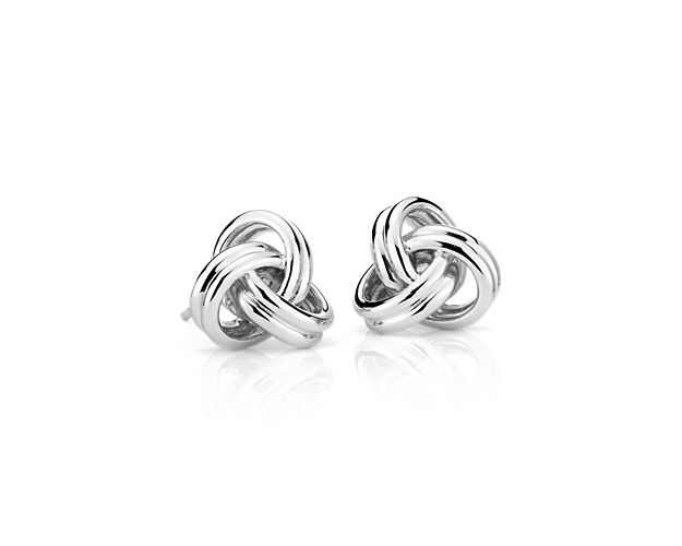 These grande luxe love knot earrings exemplify classic design with a modern update. Sterling silver links intertwine to form open, airy love knots that will become a go-to pair of earrings.