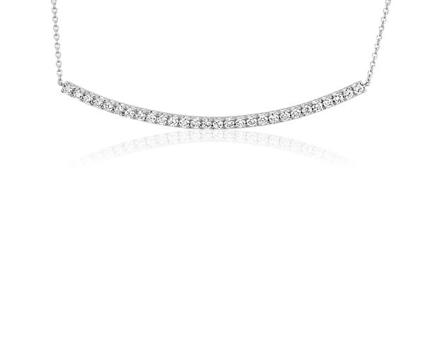 Understated brilliance at its best, this delicate curved diamond bar necklace features round diamonds set in classic 14k white gold. This stunning necklace goes from laid-back to luxury with ease and can be fastened at 16 or 18 inches for versatility.