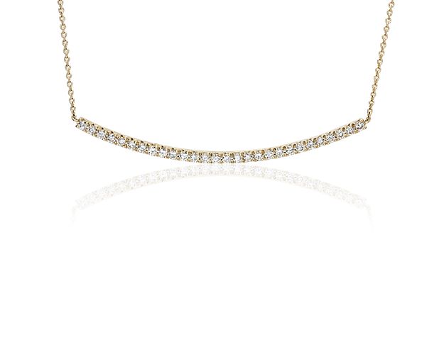 Understated brilliance at its best, this delicate curved diamond bar necklace features round diamonds set in classic 14k yellow gold. This stunning necklace goes from laid-back to luxury with ease and can be fastened at 16 or 18 inches for versatility.