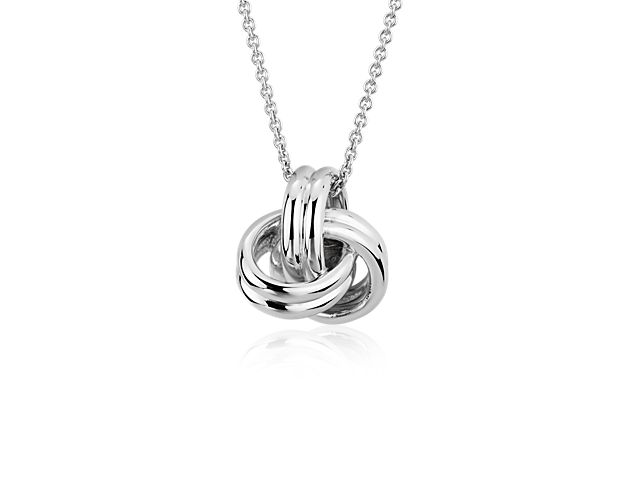 This open and airy grande luxe love knot pendant is a refreshing take on a classic design. Crafted in brightly polished sterling silver, this sophisticated necklace can be worn at 16 or 18 inches.