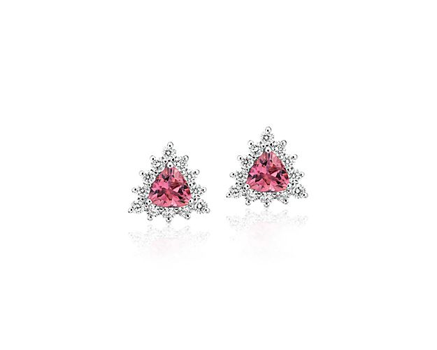 Each of these eye-catching 14k white gold stud earrings feature a single trillion-cut pink tourmaline surrounded by a brilliant halo of round-cut diamonds for a look that’s colorful and chic.