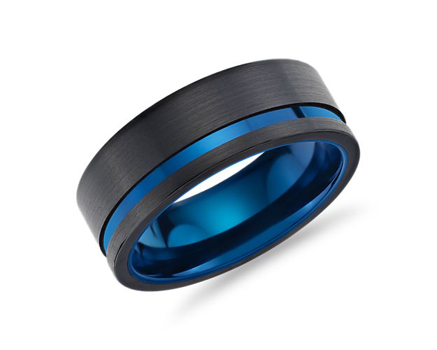 Asymmetrical in design and crafted from incredibly hard tungsten, this black wedding band with polished blue inlay creates a signature look.