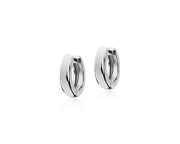 These essential hoop earrings are crafted in 14k white gold with a subtly domed design and an ultra-secure hinged snap back closure.