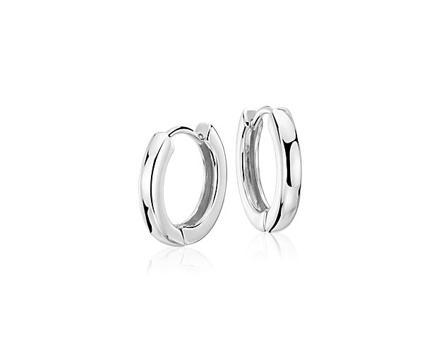 These sterling silver hoop earrings will be your everyday essential. The hollow, lightweight construction is incredibly comfortable, the hinged style easy to operate for pierced ears. At 5/8-inch diameter, with a polished finish, these silver hoop earrings are a timeless design.