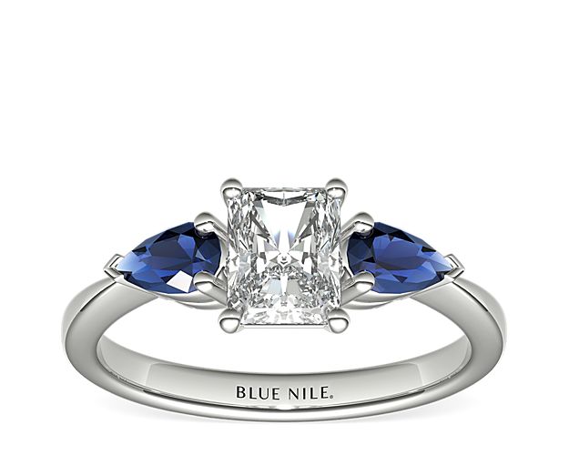 Classic Pear Shaped Sapphire Engagement Ring In Platinum with Radiant Diamond