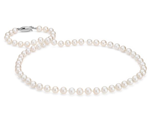 Our classic pearl strand features nearly round freshwater cultured pearls strung on a hand-knotted 20" silk blend cord, secured with a 14k white gold safety clasp. Blue Nile gemologists ensure that our pearls meet the highest quality expectations, ensuring you the best value.